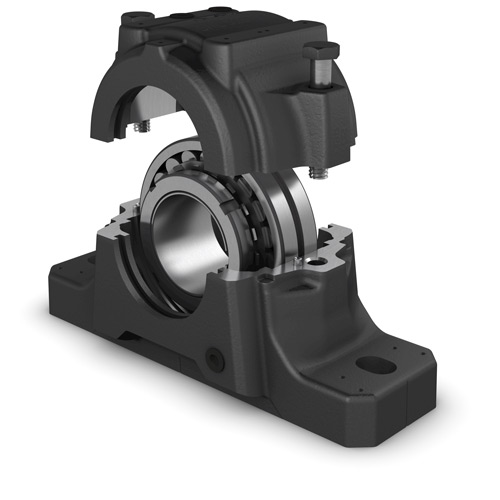Exploded view of an SKF bearing housing showing a spherical roller bearing inside