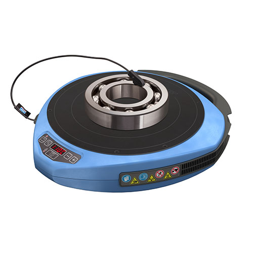 SKF TWIM 15 portable induction heater shown heating a bearing